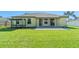 Well-maintained backyard with green grass, patio and nice sitting area at 4229 Settlers Ct, St Cloud, FL 34772