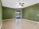 Spacious bedroom with tile flooring, sliding door and a view of the lake at 4229 Settlers Ct, St Cloud, FL 34772