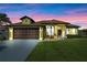 Charming single-Gathering home with lush green lawn and a two-car garage at 4229 Settlers Ct, St Cloud, FL 34772