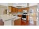 Functional kitchen featuring classic cabinetry and modern appliances at 4229 Settlers Ct, St Cloud, FL 34772