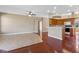 Open living area featuring a breakfast bar, wood floors, and neutral paint at 4229 Settlers Ct, St Cloud, FL 34772
