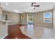 Bright living area featuring tile flooring, large windows, and a view of the lake at 4229 Settlers Ct, St Cloud, FL 34772