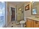 Bathroom with tiled walk-in shower, and vanity with cabinet storage at 426 S Lakemont Ave, Winter Park, FL 32792