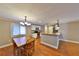 Dining area features a wooden table set with kitchen view and ample natural light at 426 S Lakemont Ave, Winter Park, FL 32792