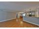 Large living room with hardwood floors extending to the dining area and kitchen at 426 S Lakemont Ave, Winter Park, FL 32792