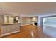 Cozy living area with hardwood floors, brick fireplace, and view of the breakfast bar at 426 S Lakemont Ave, Winter Park, FL 32792
