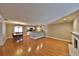 Spacious living room with hardwood floors connecting the dining area and fireplace at 426 S Lakemont Ave, Winter Park, FL 32792