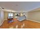 Open-concept living room features hardwood floors and a dining area near the kitchen at 426 S Lakemont Ave, Winter Park, FL 32792