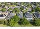 Aerial view of a home with a screened in patio and inground pool in a mature treed community at 4918 Oakway Dr, St Cloud, FL 34771