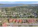 Aerial view of a planned community with homes with green space, located near a lake at 4918 Oakway Dr, St Cloud, FL 34771