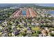 A beautiful aerial view of a community with a central lake, manicured lawns, and various home styles at 4918 Oakway Dr, St Cloud, FL 34771