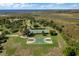 Aerial view of the neighborhood amenities featuring basketball and tennis courts, walking trails, and stunning water views at 4918 Oakway Dr, St Cloud, FL 34771