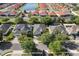 Aerial view of several well-maintained homes reveals a lake nearby and mature trees and landscaping at 4918 Oakway Dr, St Cloud, FL 34771