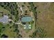 Aerial view showcasing the tennis and basketball courts plus sidewalk that connects to other community locations at 4918 Oakway Dr, St Cloud, FL 34771