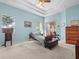 Bright bedroom with plenty of natural light, a ceiling fan, and light blue walls at 4918 Oakway Dr, St Cloud, FL 34771
