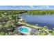 Aerial view of community pool area with patio, seating, and views of the lake at 4918 Oakway Dr, St Cloud, FL 34771