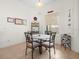 Breakfast nook with tiled floor, a round table, and natural light from the backyard at 4918 Oakway Dr, St Cloud, FL 34771