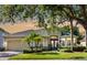 Charming single-story home featuring a well-manicured lawn, mature trees and a two-car garage at 4918 Oakway Dr, St Cloud, FL 34771