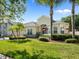 Beautifully landscaped front yard with mature palm trees enhancing the curb appeal of this lovely home at 4918 Oakway Dr, St Cloud, FL 34771