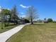 Charming gazebo along a paved path in a community park, perfect for relaxation and enjoyment at 4918 Oakway Dr, St Cloud, FL 34771