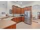 Well-equipped kitchen featuring stainless steel appliances, ample cabinet space, and tile flooring at 4918 Oakway Dr, St Cloud, FL 34771