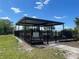 Covered playground in a fenced area, perfect for providing shade and safety for children at 4918 Oakway Dr, St Cloud, FL 34771