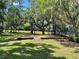 Kid-friendly playground with swings, slides and more underneath mature shade trees at 4918 Oakway Dr, St Cloud, FL 34771