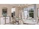 Formal dining room features a decorative chandelier, modern serving buffet, and seating for six at 5248 Stone Ridge Pl, St Cloud, FL 34771