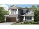 Charming two-story home with a stone-accented facade, balcony, and a two-car garage at 5248 Stone Ridge Pl, St Cloud, FL 34771