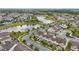 A scenic aerial view of the community showcases ponds, landscaping, and multiple residential buildings at 5892 Soter Ln, Windermere, FL 34786
