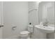 Bathroom featuring pedestal sink and toilet at 5892 Soter Ln, Windermere, FL 34786