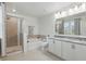 Bright bathroom with double vanity, granite countertop, and separate shower and tub at 5892 Soter Ln, Windermere, FL 34786