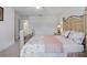 Bright bedroom featuring a wooden bed frame, plush carpet, and neutral decor at 5892 Soter Ln, Windermere, FL 34786