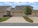 Well maintained townhome featuring a two-car garage, manicured landscaping, and a traditional exterior elevation at 5892 Soter Ln, Windermere, FL 34786