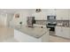 Modern kitchen featuring granite countertops, stainless steel appliances, and a large center island at 5892 Soter Ln, Windermere, FL 34786