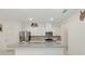 Bright, modern kitchen featuring white cabinetry and stainless steel appliances at 5892 Soter Ln, Windermere, FL 34786