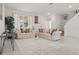 Bright living room features tile flooring, and a large window to let natural light in at 5892 Soter Ln, Windermere, FL 34786