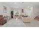 Bright living room boasts tile floors, neutral paint, and comfortable seating arrangement at 5892 Soter Ln, Windermere, FL 34786