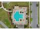 Aerial view of a community pool with brick surround, lounge chairs, shade covers, and manicured landscaping at 5892 Soter Ln, Windermere, FL 34786