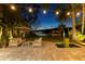 Backyard patio featuring a seating area, water feature, and serene waterfront views for relaxation at 6082 Twin Lakes Dr, Oviedo, FL 32765