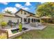 Expansive backyard with a patio, fountain, and outdoor furniture, creating an inviting outdoor living space at 6082 Twin Lakes Dr, Oviedo, FL 32765