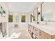 Modern bathroom with a double vanity, soaking tub, walk-in shower, and stylish contemporary design at 6082 Twin Lakes Dr, Oviedo, FL 32765