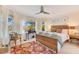 Charming bedroom with natural light, comfortable bed, and views of the exterior greenery at 6082 Twin Lakes Dr, Oviedo, FL 32765