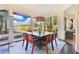 Elegant dining room with scenic views, featuring modern furnishings and stylish decor at 6082 Twin Lakes Dr, Oviedo, FL 32765