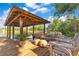 Wooden dock with seating area, ceiling fans, kayaks, and lake access for waterside living and relaxation at 6082 Twin Lakes Dr, Oviedo, FL 32765
