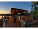 Inviting covered dock with comfortable seating, providing an idyllic lakeside retreat at 6082 Twin Lakes Dr, Oviedo, FL 32765