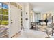 Well lit foyer showcases a decorative chandelier, tiled floors, and stylish decor at 6082 Twin Lakes Dr, Oviedo, FL 32765