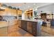 Spacious kitchen boasts stainless steel appliances, ample counter space, central island, and an open layout at 6082 Twin Lakes Dr, Oviedo, FL 32765