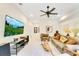 Bright living room with stylish decor, large screen television, and comfortable seating arrangement at 6082 Twin Lakes Dr, Oviedo, FL 32765