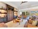 Spacious living room featuring custom built-ins, recessed lighting and an abundance of natural light at 6082 Twin Lakes Dr, Oviedo, FL 32765
